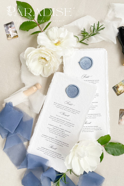 Elevate your table styling with our handmade paper wedding menus, featuring deckled edges, soft texture, and artisanal craftsmanship. Each menu is printed on 100% cotton rag paper, adorned with a wax seal in custom color, and designed to perfectly complement fine art or romantic wedding themes. These menus embody elegance, authenticity, and natural charm, making them a statement piece for your celebration.