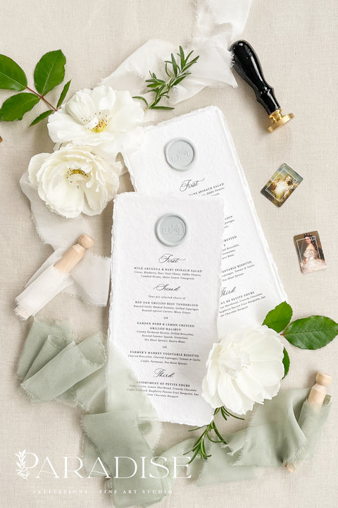 These handmade paper wedding menus exude timeless refinement and artisanal charm, designed to bring a touch of romance to your wedding tablescape. Each menu is crafted from luxurious 100% cotton rag paper, known for its soft texture and naturally deckled edges, offering an organic yet elegant finish. The menus feature classic black typography paired with a custom wax seal in soft gray, perfectly balancing simplicity and sophistication. 