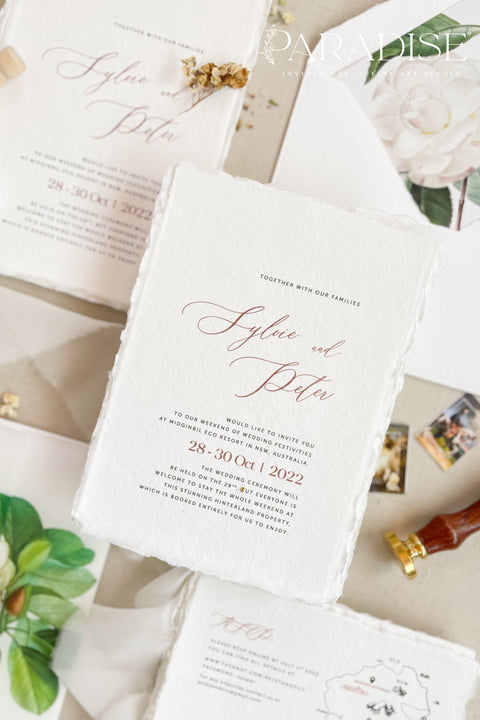 Announce your wedding with refined botanical charm through this handmade paper wedding invitation suite, adorned with vellum wraps featuring watercolor botanical artwork and a custom hand-drawn map that beautifully tells your story. Each invitation is printed on luxury deckled-edge cotton paper, offering a soft, organic texture that captures the essence of fine art craftsmanship. The botanical vellum jacket adds a touch of delicate transparency.