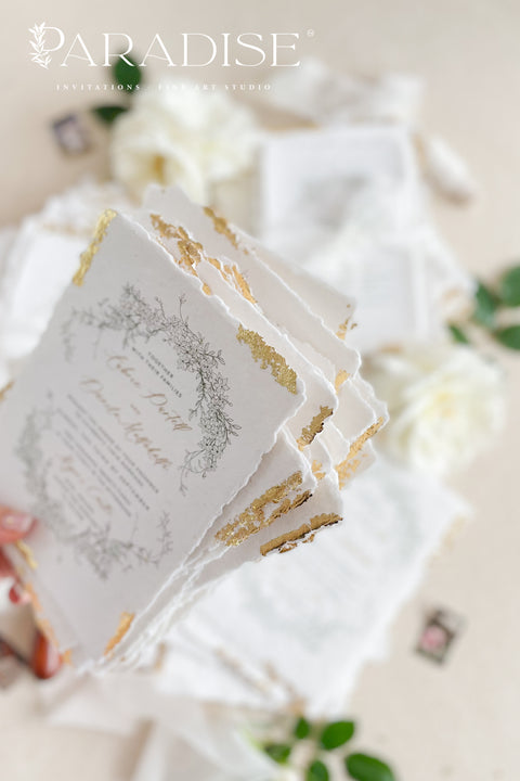 Announce your summer celebration with the perfect blend of bohemian charm and elegant sophistication with these exquisite wedding invitations. The unique wreath design adds a touch of natural beauty, while the delicate golden leaf detail provides a subtle, luxurious shimmer. This boho chic stationery is perfect for a laid-back, romantic summer wedding, setting a warm and inviting tone for your guests.