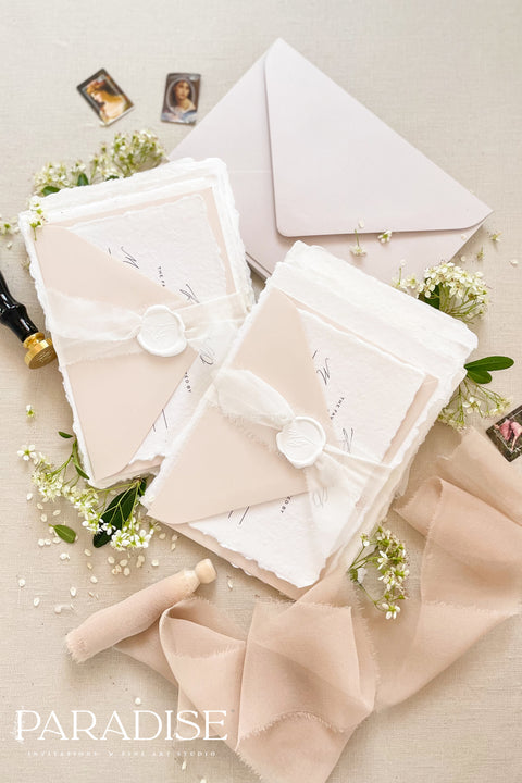 This exquisite wedding invites suite offers a blend of timeless sophistication and modern elegance. Designed with an eco-conscious approach, these luxury and timeless handmade invitations feature a beautiful modern calligraphy design and are printed on sustainable paper. The result is a truly unique and thoughtful suite that will leave a lasting impression on your guests.