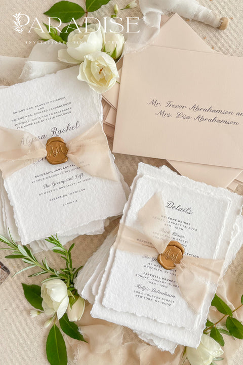 Announce your love story with timeless elegance through our&nbsp;handmade deckled-edge wedding invitations, beautifully detailed with soft blush tones, sheer ribbon, and custom wax seals. Each invitation is carefully crafted by hand using premium cotton paper for a naturally textured, fine art finish that embodies romance and sophistication.