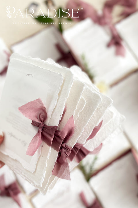 Announce your special day with the timeless beauty of these garden wedding invites. Perfect for a lush, romantic celebration, this suite combines the luxurious, tactile feel of handmade paper with an elegant, personalized monogram. The result is a truly timeless romantic wedding stationery set that feels both classic and intimately personal, leaving a lasting impression on your guests.