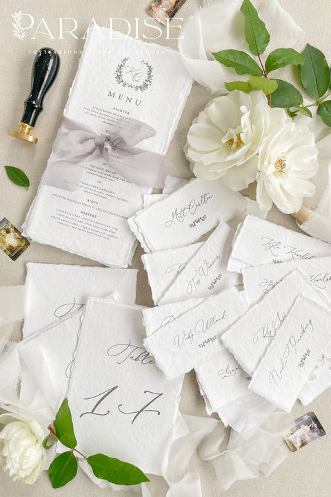 Bring timeless elegance to your event with our handmade paper place cards, crafted from luxurious cotton rag paper and finished with naturally torn deckled edges. Each name tag features refined calligraphy and a soft fine-art aesthetic, making them perfect for weddings, rehearsal dinners, intimate gatherings, and upscale celebrations. These artisan-crafted cards add texture, beauty, and sophistication to any seating display or tablescape.