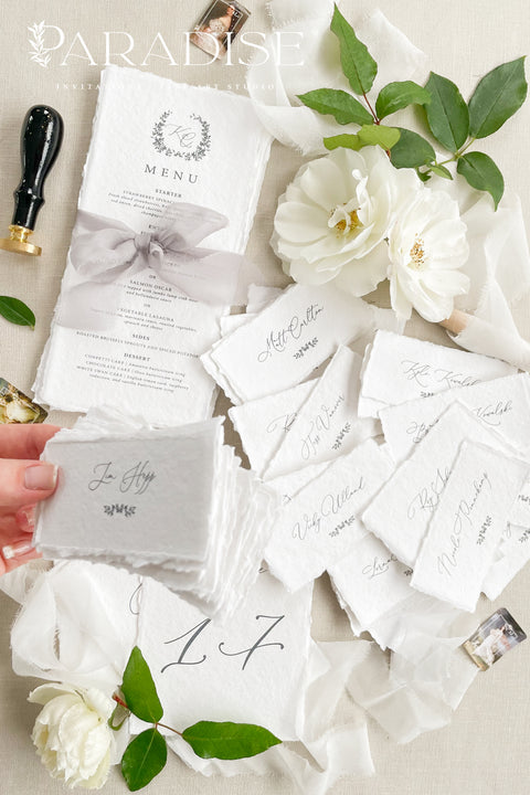 Bring timeless elegance to your event with our handmade paper place cards, crafted from luxurious cotton rag paper and finished with naturally torn deckled edges. Each name tag features refined calligraphy and a soft fine-art aesthetic, making them perfect for weddings, rehearsal dinners, intimate gatherings, and upscale celebrations. These artisan-crafted cards add texture, beauty, and sophistication to any seating display or tablescape.
