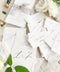 These handmade paper table numbers add a refined, elevated touch to your wedding tablescape. Premium cotton paper, soft deckled edges, and minimalist calligraphy create a timeless fine-art look that pairs beautifully with classic, organic, or modern wedding styles. Their natural texture and airy aesthetic make them perfect for capturing unforgettable reception detail shots.