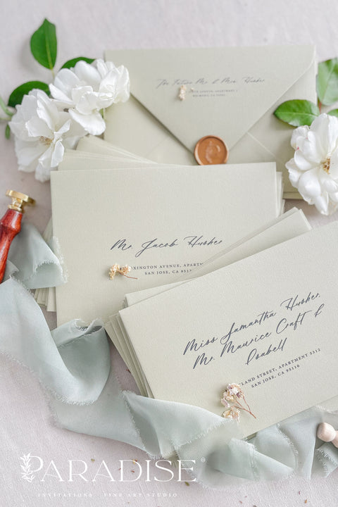 Wedding envelopes with black ink address printing, crafted from premium paper in a soft neutral tone and styled to highlight crisp typography and refined stationery quality.