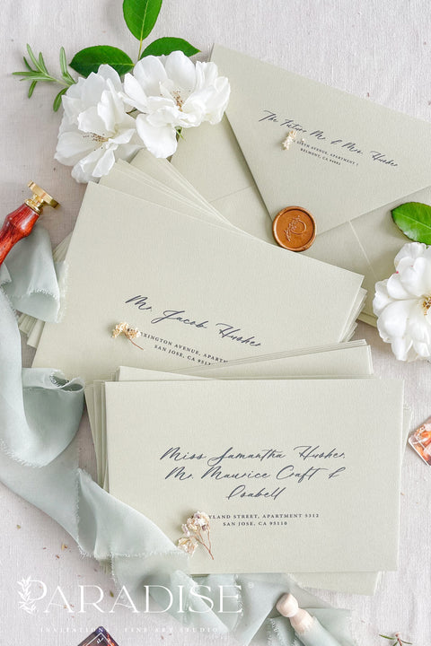 Wedding envelopes with black ink address printing, crafted from premium paper in a soft neutral tone and styled to highlight crisp typography and refined stationery quality.
