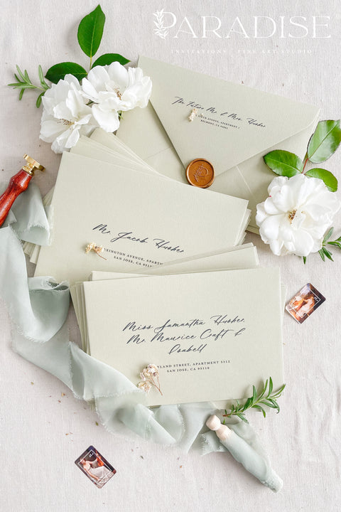 Wedding envelopes with black ink address printing, crafted from premium paper in a soft neutral tone and styled to highlight crisp typography and refined stationery quality.