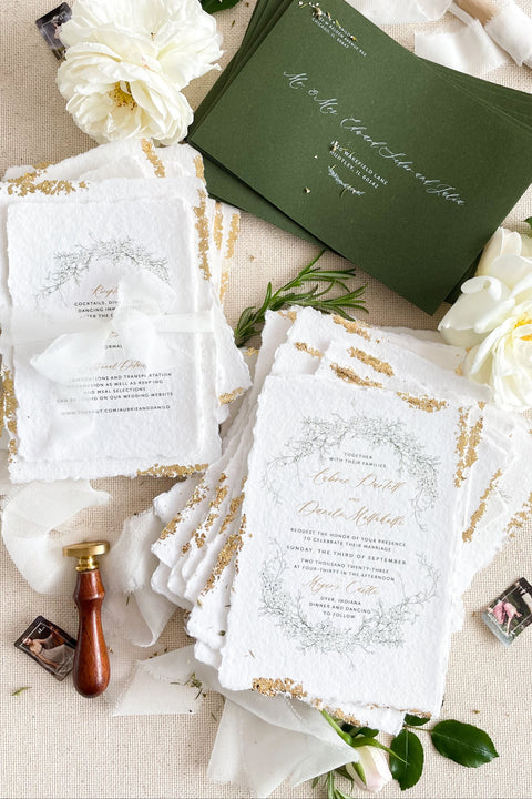 Announce your summer celebration with the perfect blend of bohemian charm and elegant sophistication with these exquisite wedding invitations. The unique wreath design adds a touch of natural beauty, while the delicate golden leaf detail provides a subtle, luxurious shimmer. This boho chic stationery is perfect for a laid-back, romantic summer wedding, setting a warm and inviting tone for your guests.