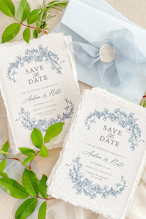 Invite your guests with timeless elegance using our handmade paper Save the Date cards, featuring a delicate blue floral wreath design inspired by fine art botanicals. Each card is printed on luxurious 100% cotton handmade paper with natural deckled edges, creating a soft, organic texture that perfectly complements romantic and refined wedding styles.