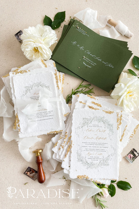 Announce your summer celebration with the perfect blend of bohemian charm and elegant sophistication with these exquisite wedding invitations. The unique wreath design adds a touch of natural beauty, while the delicate golden leaf detail provides a subtle, luxurious shimmer. This boho chic stationery is perfect for a laid-back, romantic summer wedding, setting a warm and inviting tone for your guests.