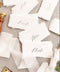 Elevate your tablescape with our handmade paper place cards, crafted from luxurious cotton rag paper and finished with naturally torn deckled edges. Each card features elegant modern calligraphy and a soft fine-art texture, making them the perfect addition to weddings, intimate dinners, bridal showers, or elevated celebrations. These artisan-made cards bring timeless beauty, organic character, and refined simplicity to any event setting.