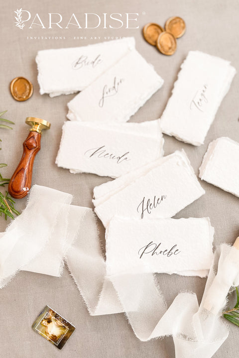 Elevate your tablescape with our handmade paper place cards, crafted from luxurious cotton rag paper and finished with naturally torn deckled edges. Each card features elegant modern calligraphy and a soft fine-art texture, making them the perfect addition to weddings, intimate dinners, bridal showers, or elevated celebrations. These artisan-made cards bring timeless beauty, organic character, and refined simplicity to any event setting.