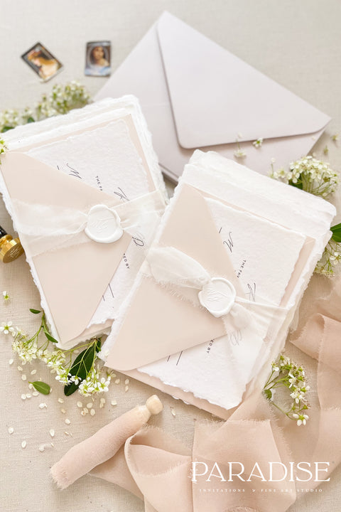 This exquisite wedding invites suite offers a blend of timeless sophistication and modern elegance. Designed with an eco-conscious approach, these luxury and timeless handmade invitations feature a beautiful modern calligraphy design and are printed on sustainable paper. The result is a truly unique and thoughtful suite that will leave a lasting impression on your guests.