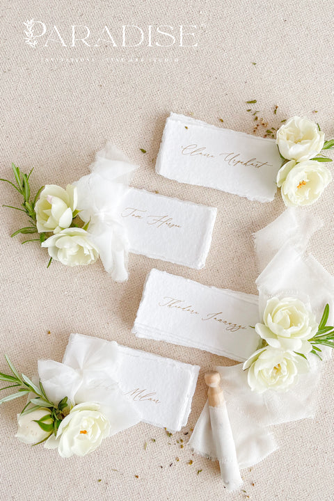 Create a romantic, fine-art tablescape with our handmade paper place cards, crafted from luxurious cotton rag paper and finished with soft, torn deckled edges. Each card features elegant calligraphy, delicate chiffon ribbon, and a timeless organic texture - perfect for weddings, intimate dinners, bridal showers, or upscale celebrations. These artisan-crafted pieces bring softness, refinement, and natural beauty to any seating display.