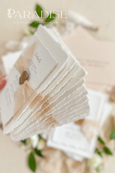 Announce your love story with timeless elegance through our&nbsp;handmade deckled-edge wedding invitations, beautifully detailed with soft blush tones, sheer ribbon, and custom wax seals. Each invitation is carefully crafted by hand using premium cotton paper for a naturally textured, fine art finish that embodies romance and sophistication.