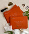 Red wedding envelopes with professional address printing, crafted from premium paper and arranged to show clean edges, rich color, and elegant typography.