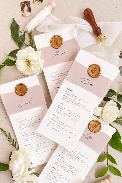 Add a romantic and refined touch to your reception with our handmade paper wedding menus, featuring dusty rose accents and gold wax seals. Each piece is crafted on luxury cotton paper with soft deckled edges, blending timeless charm with contemporary elegance - perfect for fine art or garden-inspired weddings. These menus effortlessly elevate your table styling, creating a cohesive and sophisticated dining experience.