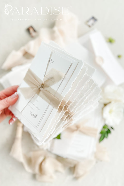 Refined, personal, and beautifully timeless - our handmade wedding invitation suite with a hand-drawn venue illustration transforms your wedding stationery into a piece of art. Each invitation is printed on 100% cotton deckled-edge paper, tied with a soft taupe silk ribbon, and sealed with an ivory wax seal for a sophisticated, heirloom finish. The custom venue sketch captures the heart of your celebration. 