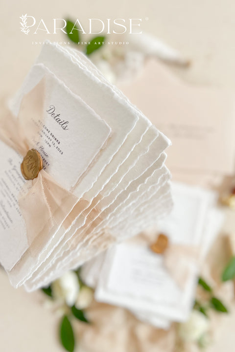 Announce your love story with timeless elegance through our&nbsp;handmade deckled-edge wedding invitations, beautifully detailed with soft blush tones, sheer ribbon, and custom wax seals. Each invitation is carefully crafted by hand using premium cotton paper for a naturally textured, fine art finish that embodies romance and sophistication.