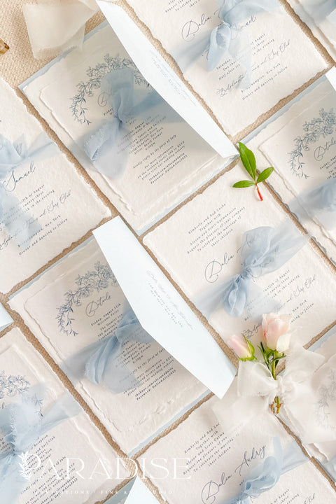 Announce your special day with timeless, heartfelt style. This botanical wedding invitation suite is crafted on our signature, luxurious handmade paper, made from 100% recycled cotton rag. The unique deckled edges and soft texture provide an artisan feel that is both rustic and elegant, setting a deeply romantic tone for your ceremony. Featuring delicate botanical illustrations, each invite is an eco-friendly choice that leaves a lasting impression on your guests.