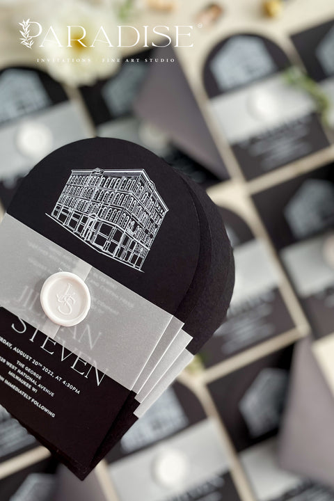 Bold, elegant, and full of character - our arched wedding invitation suite is designed for couples who want to make a statement. Printed on luxurious black cardstock, each invitation features a hand-drawn illustration of your wedding venue, adding a deeply personal and artistic touch to your stationery. Wrapped in a vellum belly band and finished with a white wax seal, this suite blends modern sophistication with timeless craftsmanship.