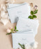 Coco linen wedding envelopes with professional address printing, showing linen texture, soft neutral color, and refined typography for fine art stationery.