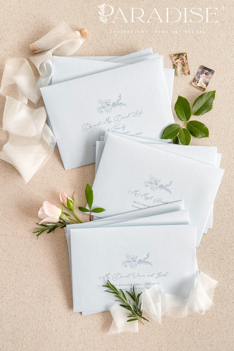 Coco linen wedding envelopes with professional address printing, showing linen texture, soft neutral color, and refined typography for fine art stationery.