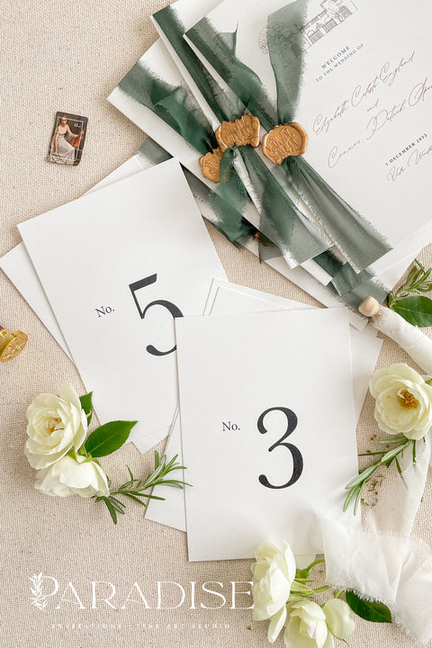 A beautifully clean and timeless table number design created with bold black serif typography on premium white cardstock. The minimalist layout delivers effortless sophistication, making it the perfect choice for modern, traditional, and elegant weddings alike. With crisp readability and a polished finish, each card enhances your tablescape while guiding guests with style and clarity.