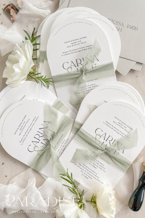 Our arched wedding invitation suite is perfect for couples seeking a modern yet romantic stationery style. The smooth arch shape brings a contemporary edge, while the sage green silk ribbon adds a soft, botanical touch. Printed on premium white matte cardstock, this suite features clean, modern typography and delicate detailing that beautifully complements any wedding theme - from garden to destination to modern minimalist celebrations.