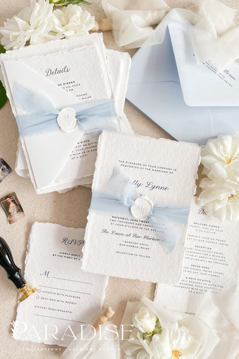 Elegant, romantic, and handmade with love - our fine art wedding invitation suite is crafted from luxury cotton deckled-edge paper and finished with a delicate powder blue chiffon ribbon and white wax seal. The soft blue tones and artisanal textures make this suite perfect for fine art, coastal, or destination weddings, offering a serene yet refined aesthetic that feels effortlessly graceful.