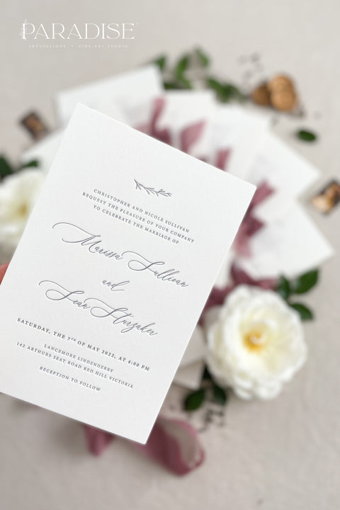 This wedding invitation suite exudes timeless romance and refined modernity, perfect for couples who love soft luxury and intentional design. Wrapped in delicate vellum jackets and tied with rich burgundy silk ribbons, each invitation feels like an elegant love letter - graceful, textured, and unforgettable. Printed on luxury fine art cardstock, the minimalist typography and spacious layout create a beautifully balanced aesthetic that feels both modern and classic.