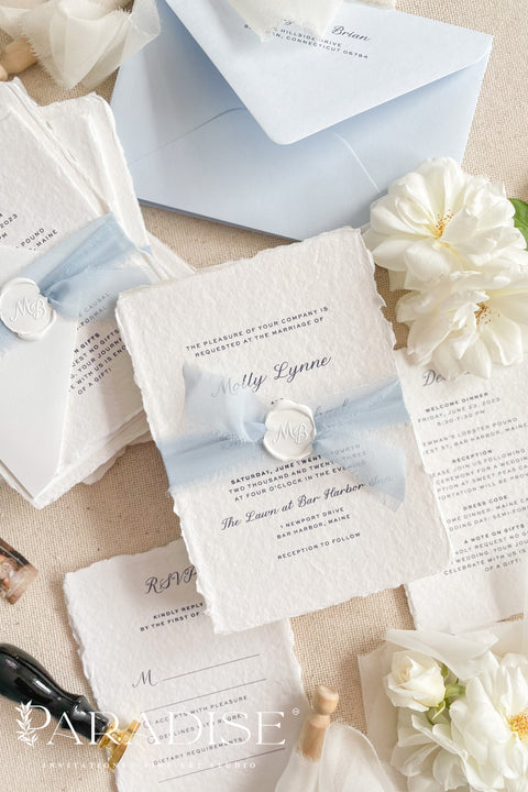 Elegant, romantic, and handmade with love - our fine art wedding invitation suite is crafted from luxury cotton deckled-edge paper and finished with a delicate powder blue chiffon ribbon and white wax seal. The soft blue tones and artisanal textures make this suite perfect for fine art, coastal, or destination weddings, offering a serene yet refined aesthetic that feels effortlessly graceful.