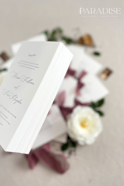 This wedding invitation suite exudes timeless romance and refined modernity, perfect for couples who love soft luxury and intentional design. Wrapped in delicate vellum jackets and tied with rich burgundy silk ribbons, each invitation feels like an elegant love letter - graceful, textured, and unforgettable. Printed on luxury fine art cardstock, the minimalist typography and spacious layout create a beautifully balanced aesthetic that feels both modern and classic.