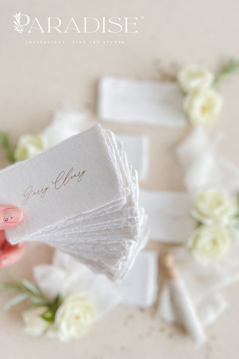 Create a romantic, fine-art tablescape with our handmade paper place cards, crafted from luxurious cotton rag paper and finished with soft, torn deckled edges. Each card features elegant calligraphy, delicate chiffon ribbon, and a timeless organic texture - perfect for weddings, intimate dinners, bridal showers, or upscale celebrations. These artisan-crafted pieces bring softness, refinement, and natural beauty to any seating display.