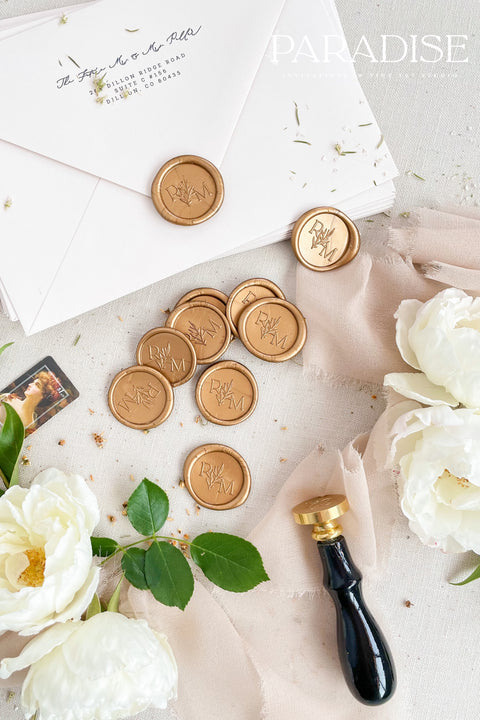 Golden wax seals bring a warm, timeless elegance to your wedding stationery, adding a luxurious finishing touch to envelopes, invitations, and keepsakes. Hand-poured with care, each seal features a rich golden tone that catches the light beautifully, creating a refined detail that feels both classic and romantic. Perfect for weddings, bridal showers, christenings, and fine-art paper suites, these wax seals elevate every piece they adorn.