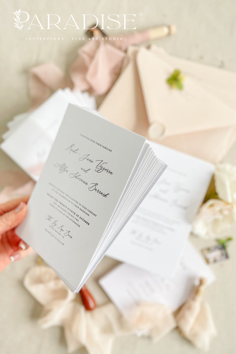 Delicate, romantic, and effortlessly graceful - this letterpress wedding invitation suite blends modern minimalism with artisanal charm. Each piece is crafted on thick, premium cotton paper, with deep letterpress impressions that capture the poetry of fine stationery. Wrapped in translucent vellum, tied with a blush silk ribbon, and finished with a wax seal, this suite is designed for couples who appreciate sophistication in every detail.