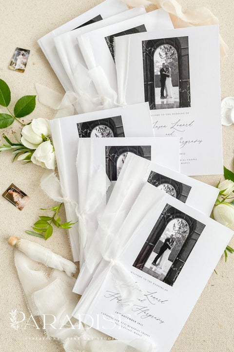 A beautifully printed ceremony program featuring your favorite photograph, wrapped in soft chiffon ribbon and crafted on luxurious fine-art paper. The design blends modern minimalism with heartfelt storytelling - allowing your guests to step into your love story the moment they take their seat. With its elegant typography, timeless black-and-white imagery, and heirloom-quality materials, it becomes more than a program - it becomes a cherished keepsake of your day.