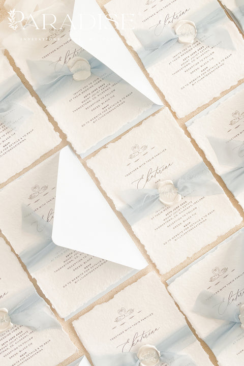 Delicate, timeless, and effortlessly romantic - this handmade paper wedding invitation suite is the perfect blend of fine art elegance and heartfelt simplicity. Printed on luxury deckled-edge cotton paper, each invitation exudes artisanal charm, its softly torn edges and tactile texture embodying the beauty of handcrafted design. Tied with a dusty blue silk ribbon and sealed with a white wax monogram, this suite radiates an ethereal calm - a whisper of something classic and pure.